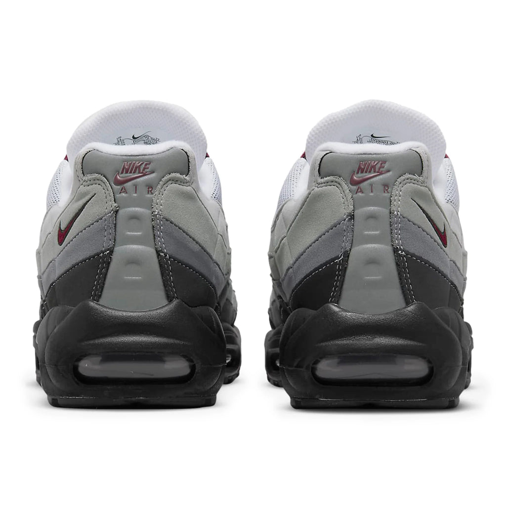 Back view of Nike Air sneakers in grey, black, and white, featured by Lloyds Jones Footwear