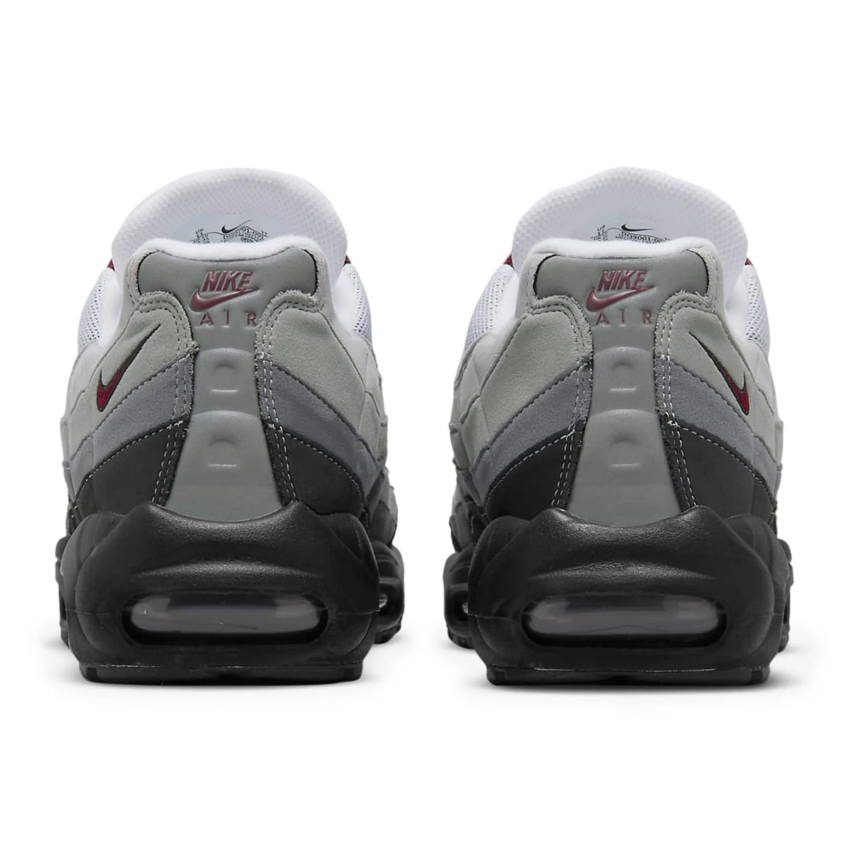 Back view of Nike Air sneakers in grey, black, and white, featured by Lloyds Jones Footwear